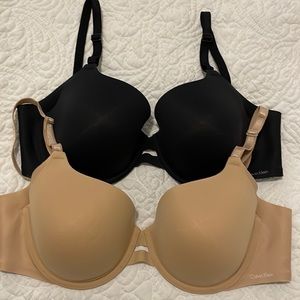 Pair of Calvin Klein 34D underwire bras, black and nude